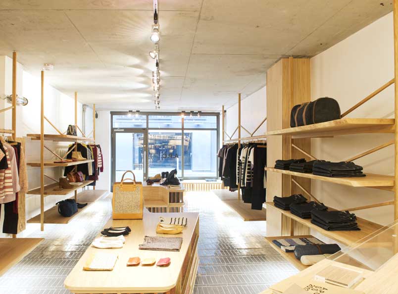 Oak shelves, hanging rails and display units with integrated lighting